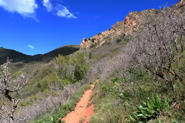 Hiking on the Grandeur Peak trail in the snowcapped Wasatch Mountain Range, Salt Lake City, Utah