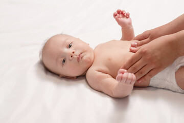 baby belly massage, close-up of hands of woman
