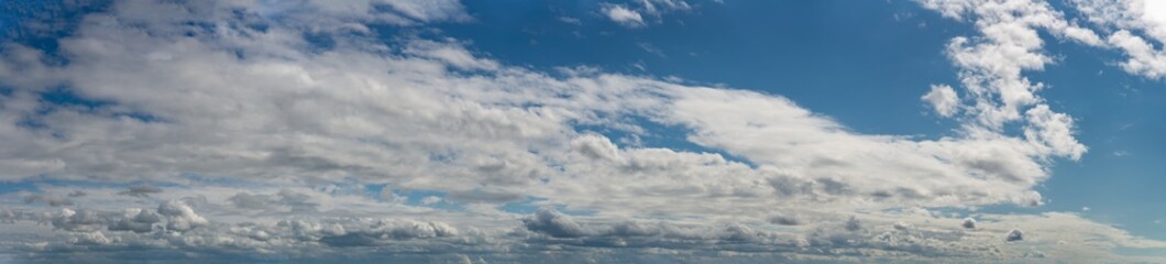 Fototapeta na wymiar Fantastic clouds against blue sky, panorama