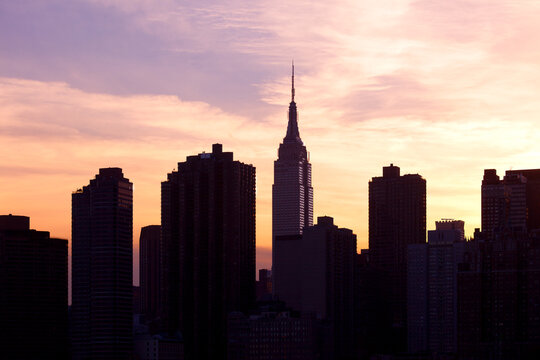 Cityscape of New York City at sunset.
