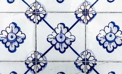 Portuguese traditional tiles Azulejos with blue floral pattern on a white background.