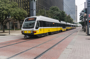 Naklejka na ściany i meble Tram traveling through downtown Dallas.
