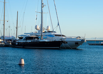 Obraz premium Two sailboats moored at pier