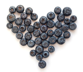 Healthy snack: heart-shaped blueberries isolated on white
