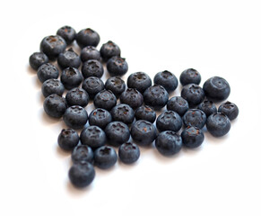 Healthy snack: heart-shaped blueberries isolated on white
