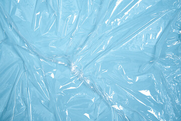 Clear plastic texture with blue color. Nylon polythene wrap. Plastic free lifestyle, ecology...