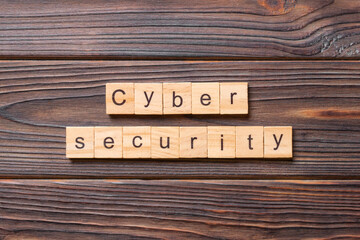 Cyber Security word written on wood block. Cyber Security text on cement table for your desing, concept