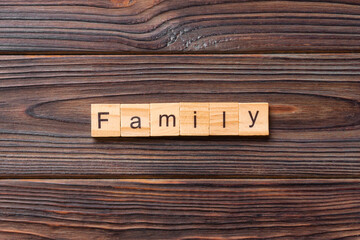 family word written on wood block. family text on table, concept