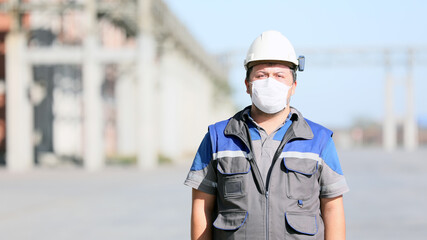 The worker is using personal protective equipments. For healthcare professionals caring for people with covid-19, the CDC recommends placing the person in an airborne infection isolation room.