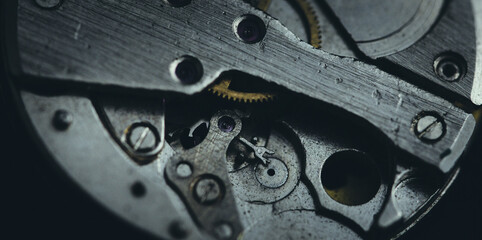 Old clockwork dirty with dust and lubricating oil. Selective focus. Shallow depth of field. Toned