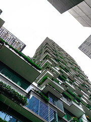 Fototapeta na wymiar Apartment block in Sydney NSW Australia with hanging gardens and plants on exterior of the building 