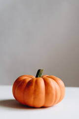 Orange pumpkin on a whtie background. Halloween concept.