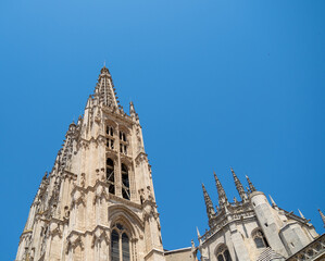 burgos cathedral tower in gothic style with blue