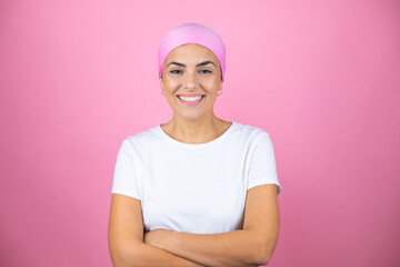 Young beautiful woman wearing pink headscarf over isolated pink background with a happy face...