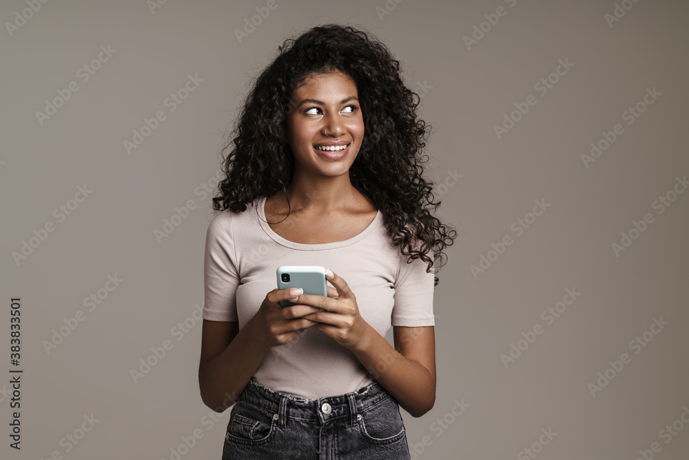 Canvas Prints smiling woman with afro hairstyle typing text message