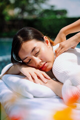 Obraz na płótnie Canvas Woman enjoy spa treatment outdoors near swimming pool.