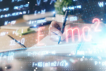 Science formula hologram over woman's hands taking notes background. Concept of study. Double...