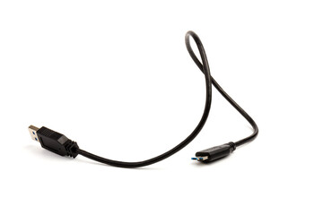 USB cable close up on white background. Charge, plugging, equipment and electricity