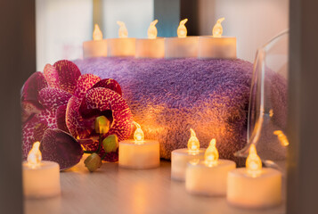 Candles, flowers, towel