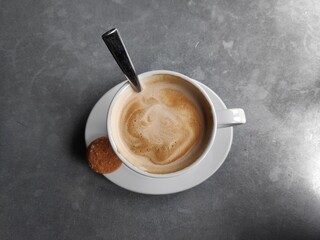 A cup of coffee with yummy cookie