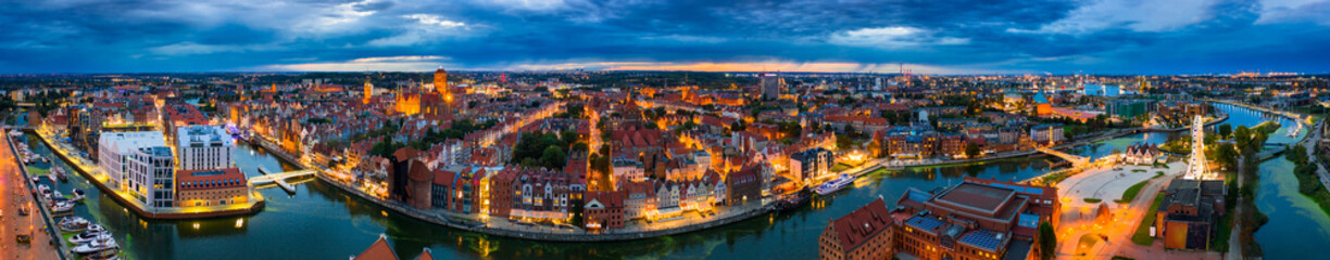 Aerial panorama of the Gdańsk city over Motława river with amazing architecture at dusk,  Poland - obrazy, fototapety, plakaty