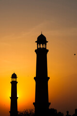 Sunset behind the minarets of a mosque 