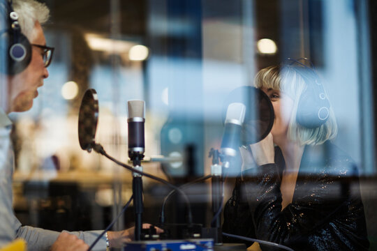 People broadcasting from radio station