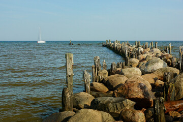 Travel photo of city Engure, Latvia. Baltic Sea with waves and mole