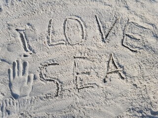 The inscription on the sand 