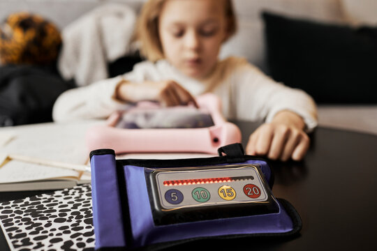 High angle view of AHDA aid, child writing on background