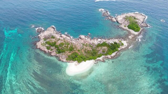 Aerial view footage of beautiful Sandbank island in clear turquoise blue ocean water at the Island of Redang, Terangganu Malaysia