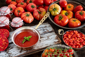 Many sliced tomatoes on the kitchen counter
