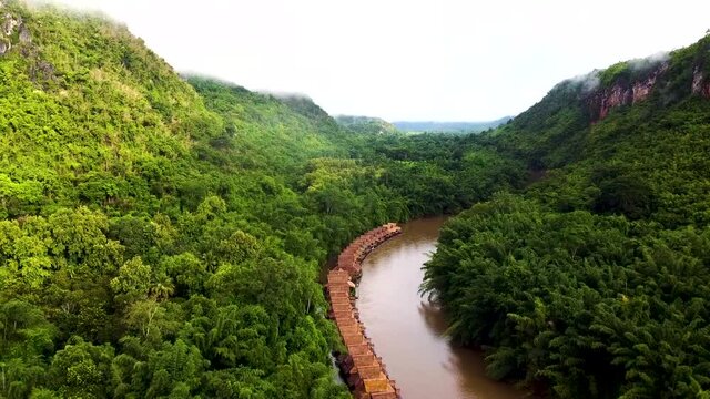 Movement scene in the morning, pass the raft float in river, Kanchanaburi Thailand.