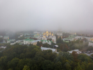 Aerial drone view. Kiev Pechersk Lavra in a dense fog.