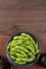 Top view of fresh boiled edamame with copy space.