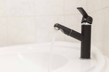 bathroom with white sink, modern black techno mixer