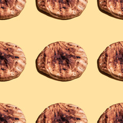 Seamless pattern with naan bread on yellow background. Minimal food pattern.