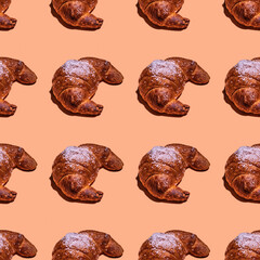 Seamless pattern with croissant on coral background. National Croissant Day.