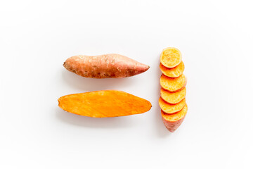 Pattern with sweet potato - yams. Organic vegetables background, overhead view