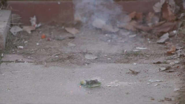 lighting a firework on New Years day and it goes off and propels itself into the air.