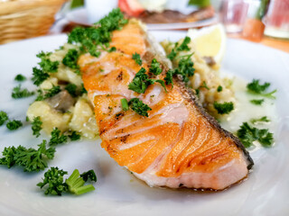 Grilled salmon and rice-french cuisine dish with tomato and salmon