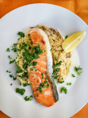 Grilled salmon and rice-french cuisine dish with tomato and salmon