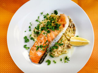 Grilled salmon and rice-french cuisine dish with tomato and salmon