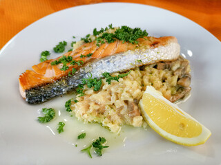 Grilled salmon and rice-french cuisine dish with tomato and salmon