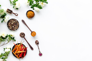 Various aromatic and hot spices with herba and flowers, view from above