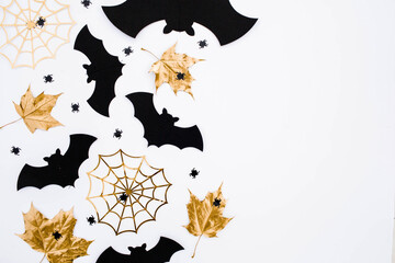 Banner.The inscription happy Halloween. Modern background with black bats, Golden leaves, cobwebs...