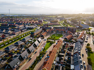 Fototapeta Top view of house Village from Drone capture in the air house is brown roof top Urk netherlands Flevoland. High quality photo with drone obraz