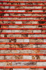 Mur en briques rouge - Arrière plan texturé grunge et industriel	