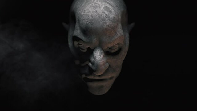 Animation of the appearance of a monster face  from the darkness. Horror scene or Halloween decoration.
