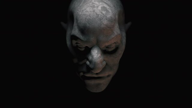 Animation of the appearance of a monster face  from the darkness. Horror scene or Halloween decoration.